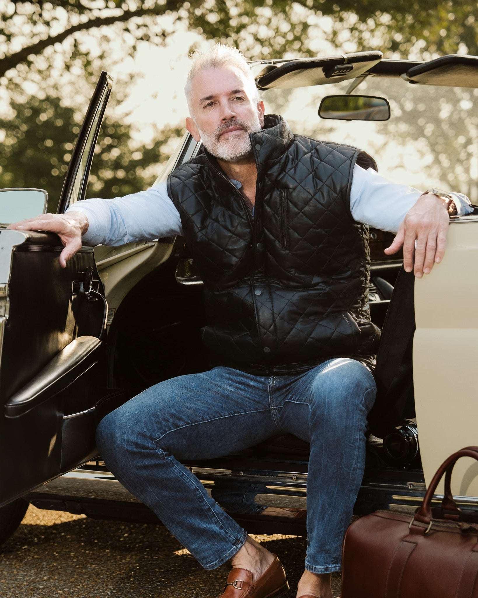 The black quilted leather vest embodies a timeless elegance, perfect for the sophisticated man who values both form and function.