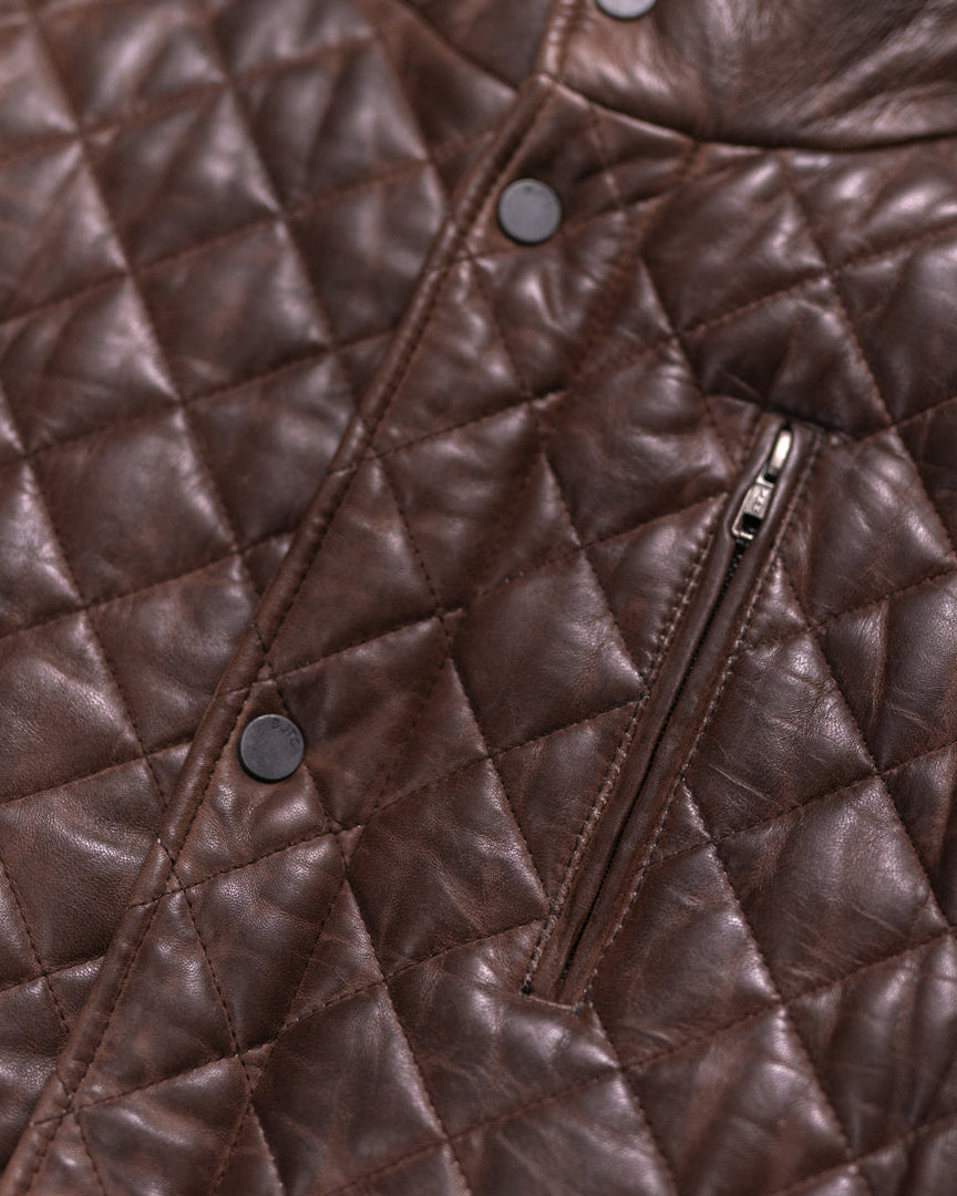Quilted leather jacket in rich mahogany brown, perfect for cool weather with its cozy design.