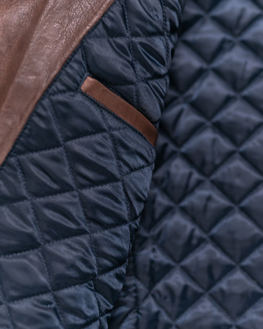 High-quality quilted leather jacket in mahogany brown, offering both warmth and elegance.