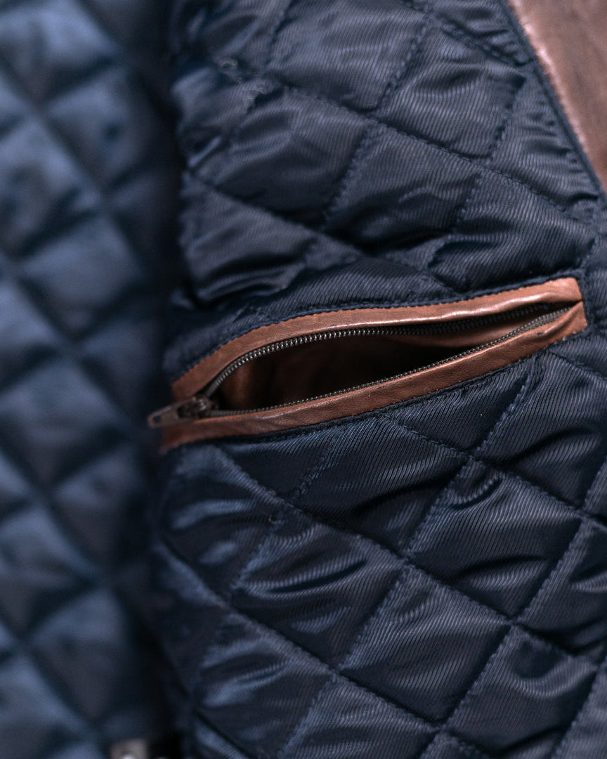 Classic quilted leather jacket in a striking mahogany brown, perfect for adding a touch of luxury to any outfit.