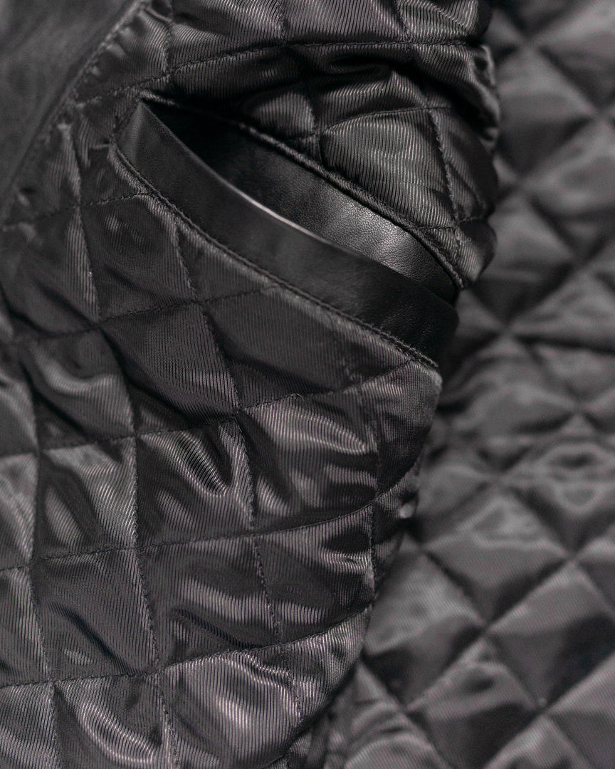 Ideal for the modern gentleman, this black quilted vest offers a touch of luxury with its supple leather and impeccable stitching, making it a standout piece in any wardrobe.
