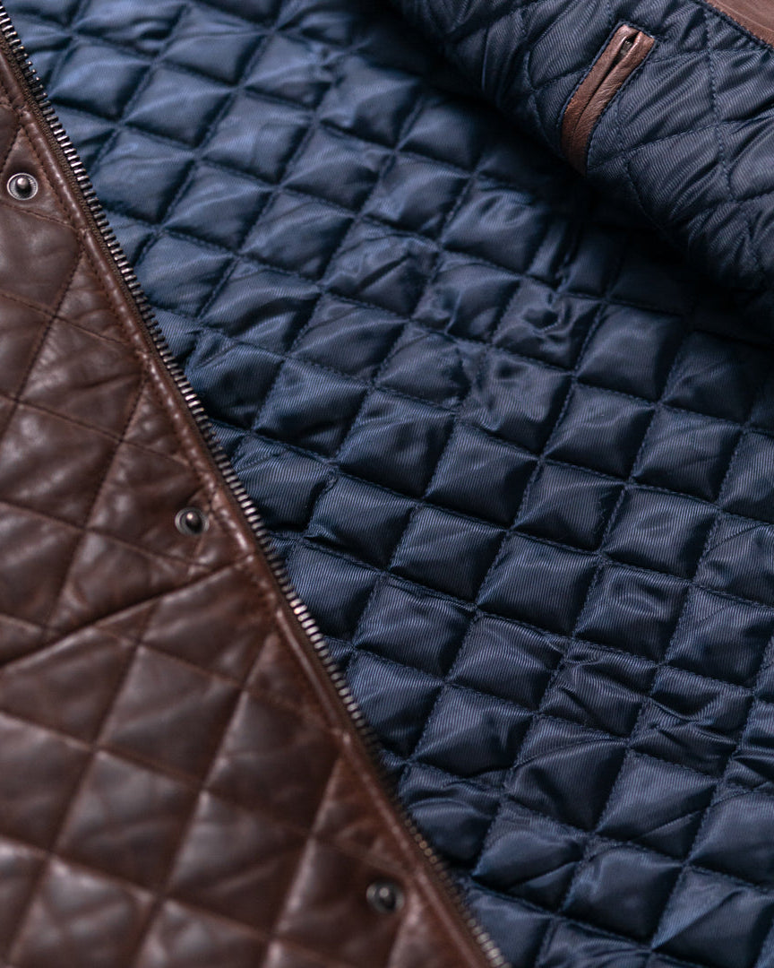 Stylish and functional, this brown quilted leather vest combines modern design with timeless appeal.