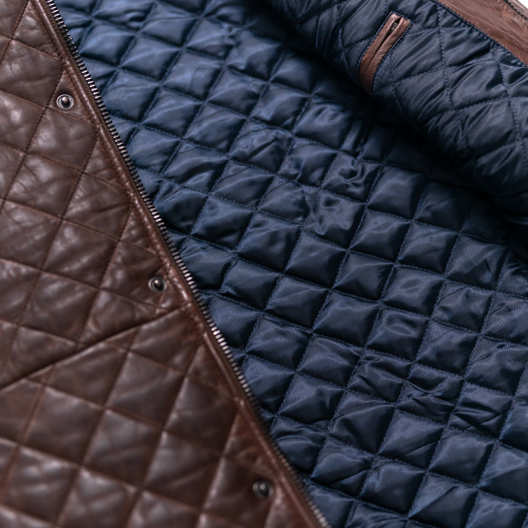 Stylish and functional, this brown quilted leather vest combines modern design with timeless appeal.